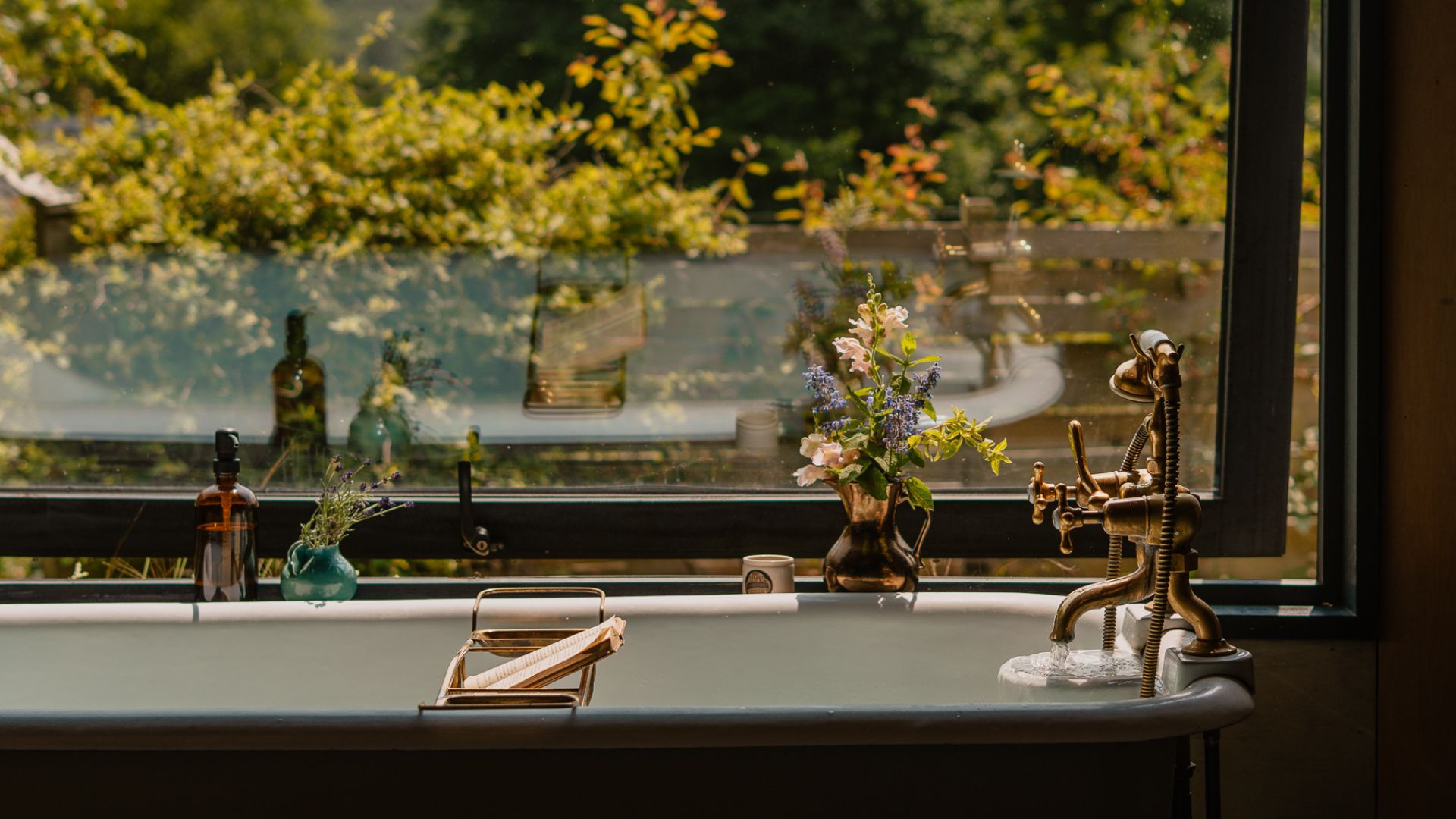 The bath and view from the window of Hergest Lee Cabin