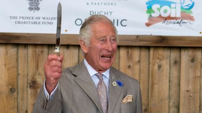 Prince Charles, Prince of Wales cuts a celebratory cake at the Innovative Farmers 10th anniversary at Trefranck Farm, Nr Launceston in Cornwall on the second day of his annual visit to the South West, on July 19, 2022 in Launceston, England. The Duke and Duchess of Cornwall are on a 3-day visit to the southwestern region to celebrate the Prince of Wales' 70th year as the Duke of Cornwall. 