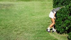 Golfer searching for ball