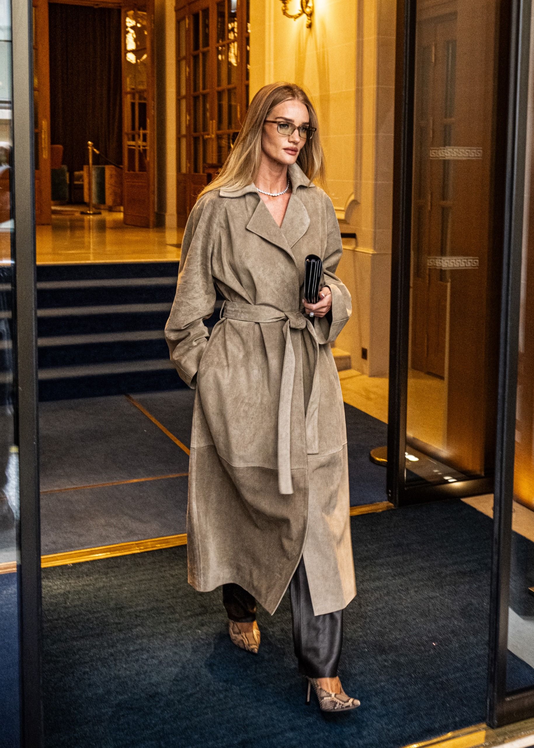 Rosie Huntington Whiteley wearing The Row suede coat in beige.