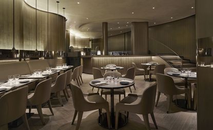 Emporio Armani Main floor with beige colour scheme tables and chairs