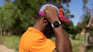 Google Pixel Watch being worn by a man outdoors