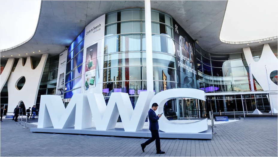 A white sign reads &#039;MWC&#039; outside of the Fire Barcelona convention centre. 