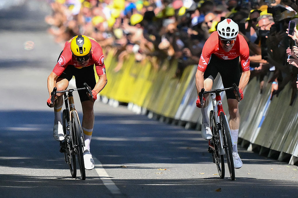 Uno-X Mobility team's Norwegian rider Jonas Abrahamsen (L) cycles ahead of Team Jayco AlUla team's Swiss rider Mauro Schmid (R) to win the 11th stage of the 112th edition of the Tour de France cycling race, 156.8 km starting and finishing in Toulouse, southwestern France, on July 16, 2025. (Photo by Marco BERTORELLO / AFP) (Photo by MARCO BERTORELLO/AFP via Getty Images)