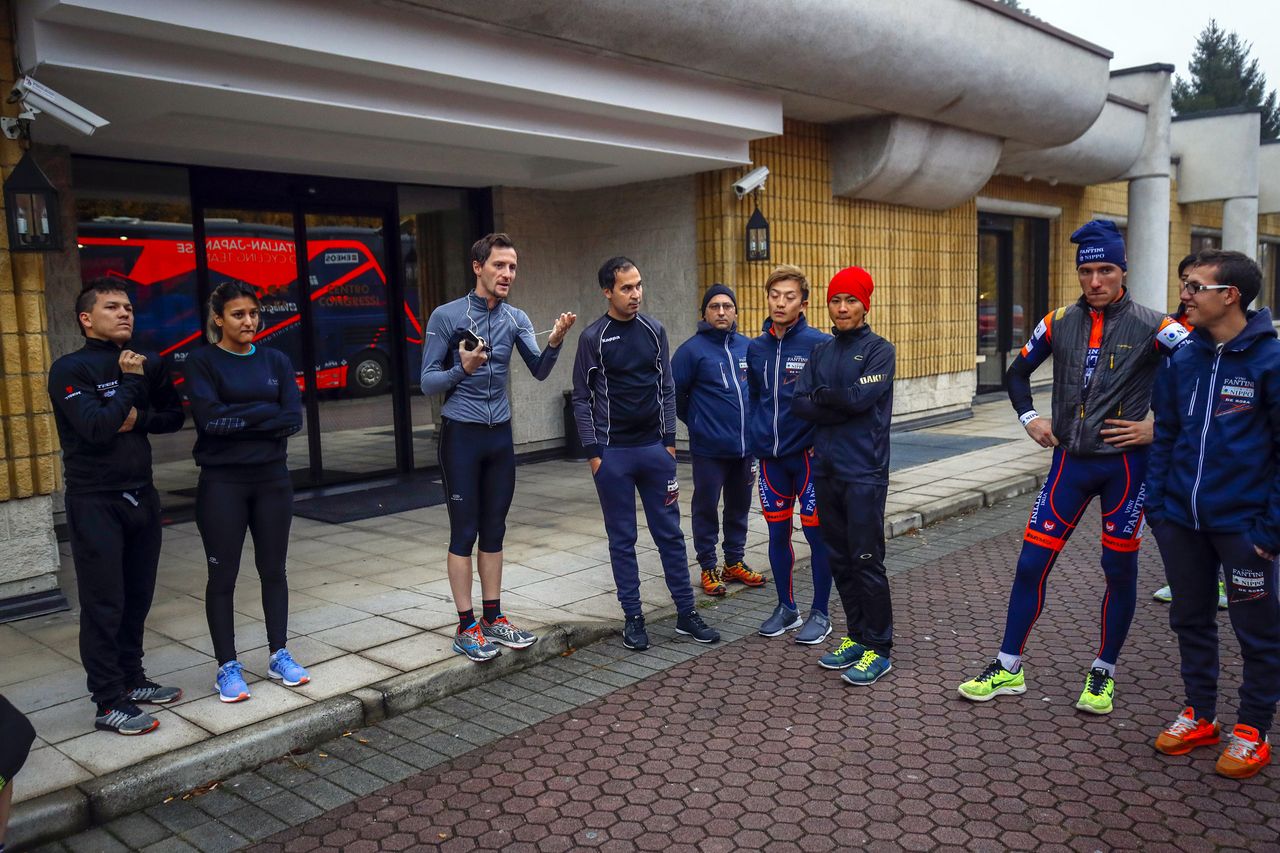 Riders and staff talk before going out for a run