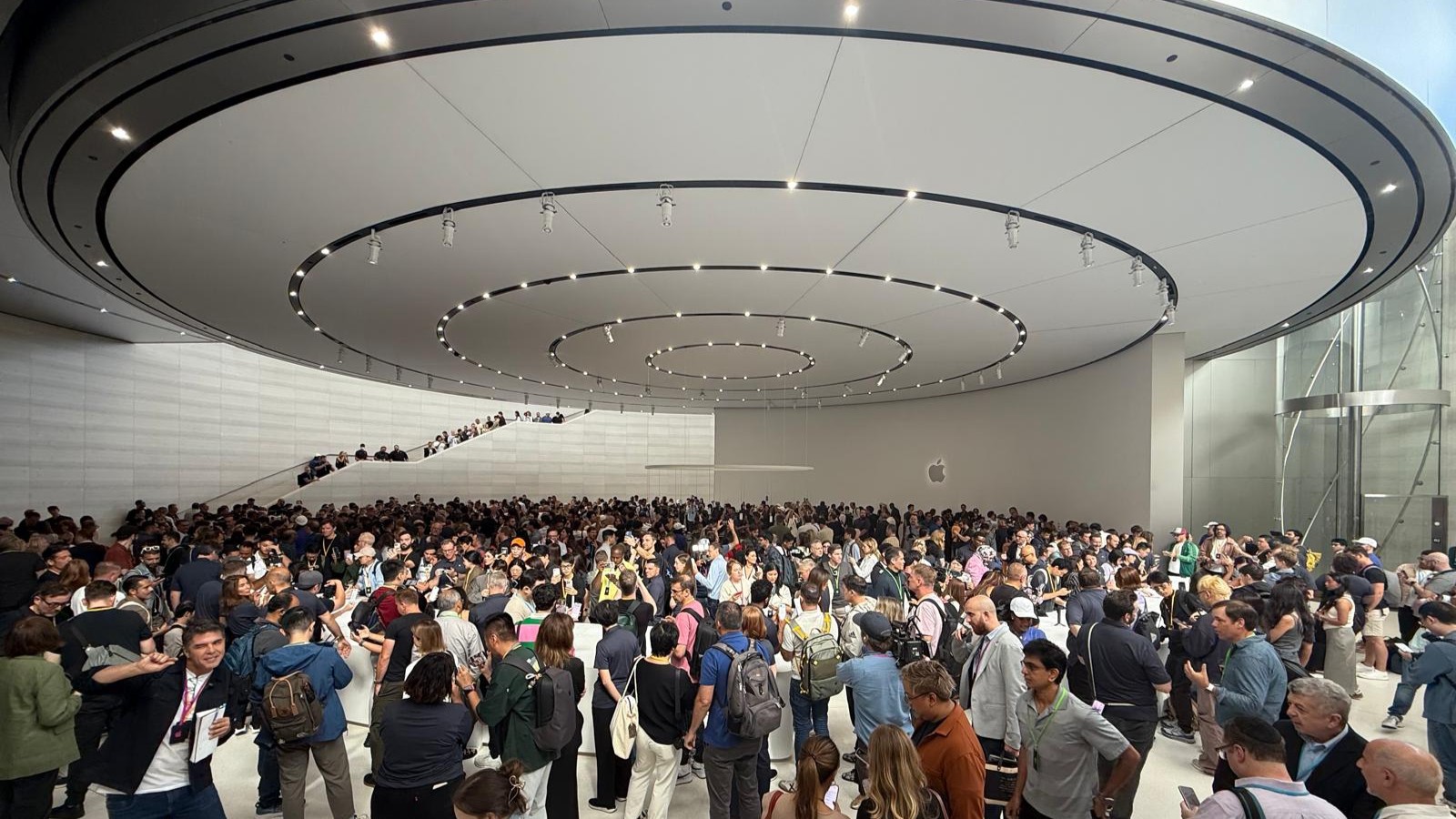A crowd of people inside a building at Apple Park