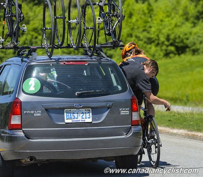 Mechanic Chad Grochowina adjusts Ramsden's brake after her crash