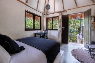 One of the rooms nestled in the jungle at Nest