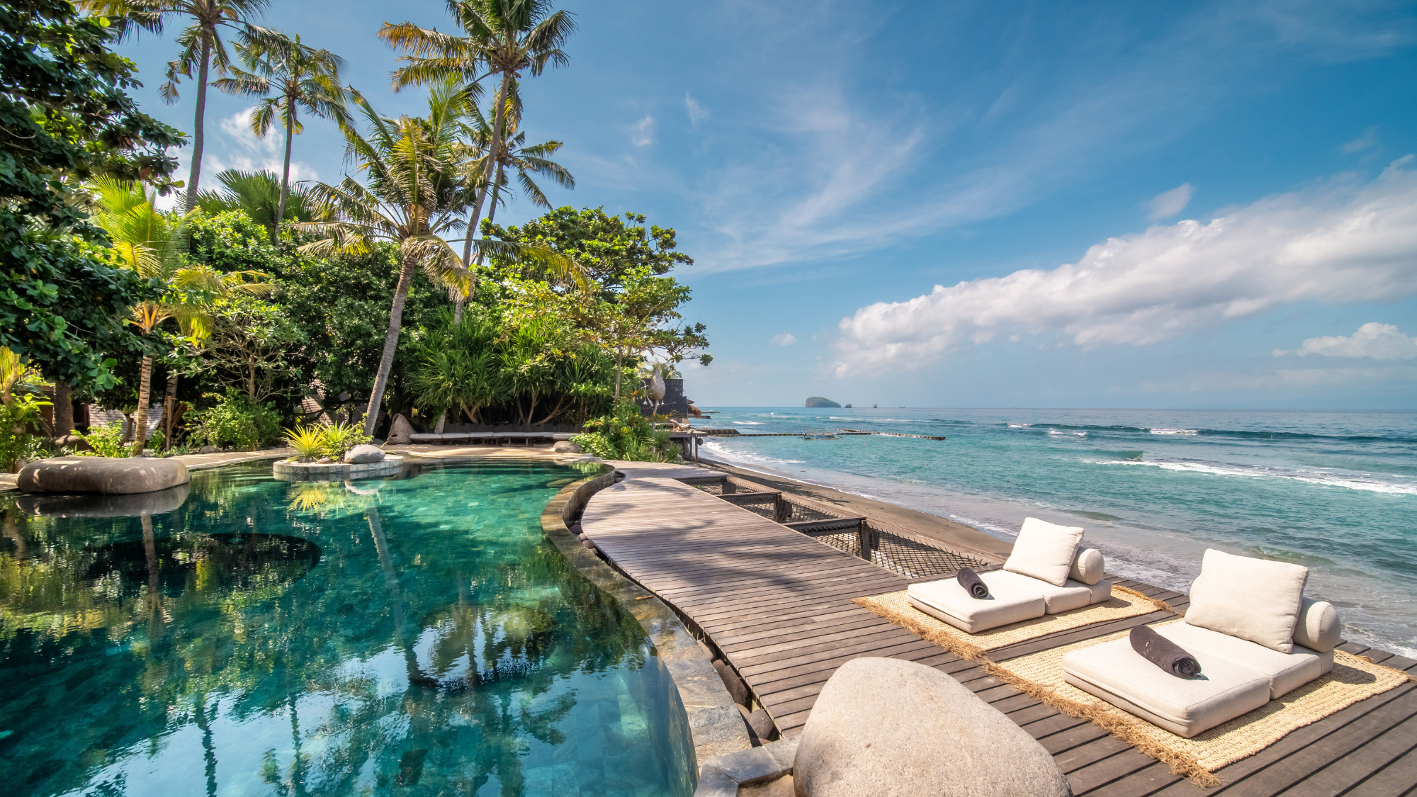 Outdoor pool and sun loungers at The Seed, Bali