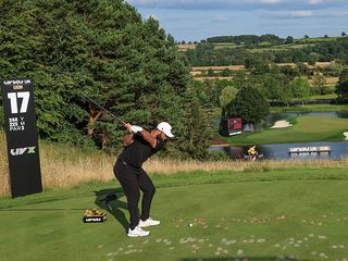 Jon Rahm hitting a tee shot on the 17th hole at JCB Golf Club For LIV GOLF United Kingdom