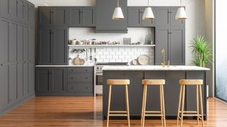 slate grey kitchen cabinetry against white painted walls and white metro tiles