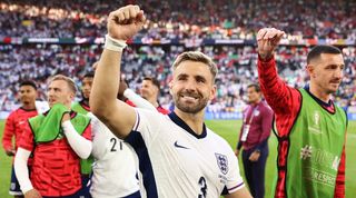 Luke Shaw celebrates after England&#039;s win over Switzerland on penalties at Euro 2024.