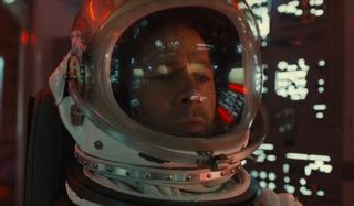 Ad Astra Brad Pitt surrounded by buttons and instrument panels in his spacecraft