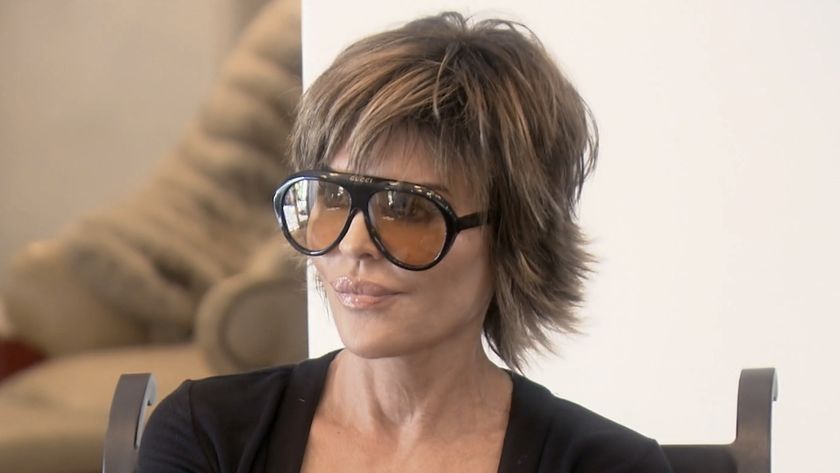 Rinna wearing sunglasses and talking to Erika in the Season 12 premiere of RHOBH
