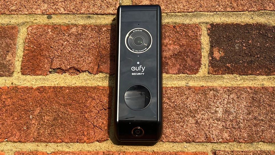 The fron view of the Eufy Video Doorbell Dual on a brick wall