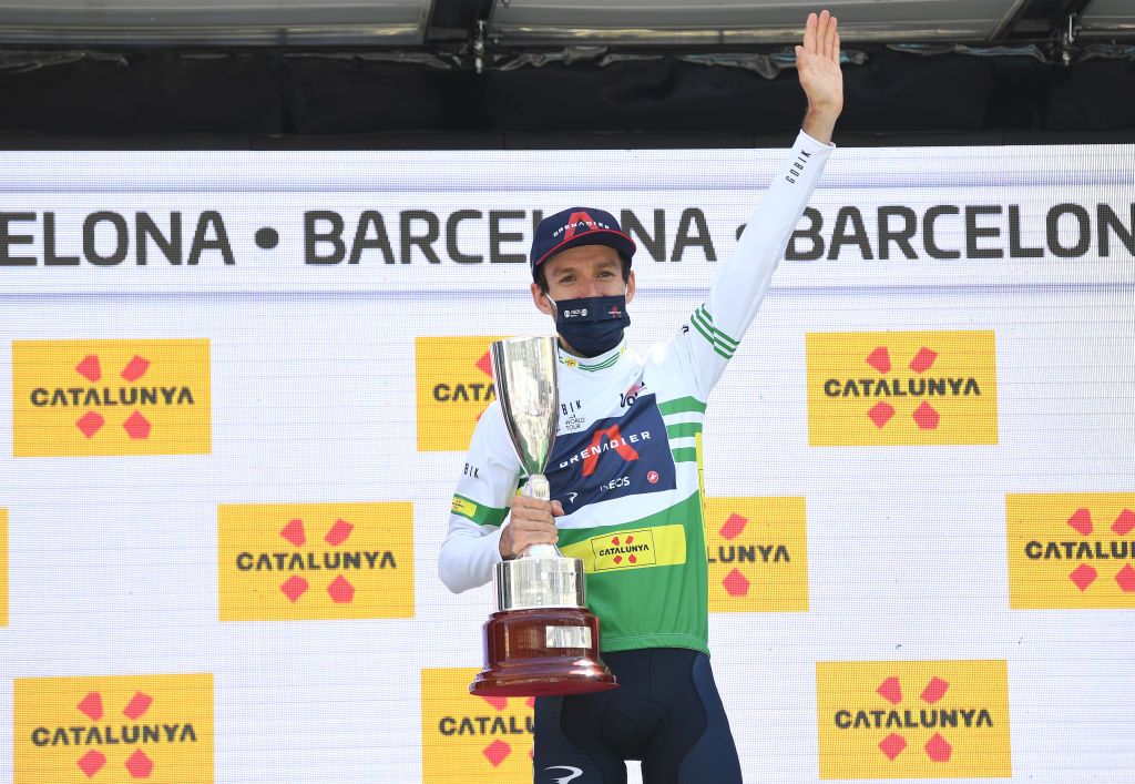 BARCELONA SPAIN MARCH 28 Podium Adam Yates of United Kingdom and Team INEOS Grenadiers Green Leader Jersey Celebration during the 100th Volta Ciclista a Catalunya 2021 Stage 7 a 133km stage from Barcelona to Barcelona Mask Covid safety measures Trophy VoltaCatalunya100 on March 28 2021 in Barcelona Spain Photo by David RamosGetty Images