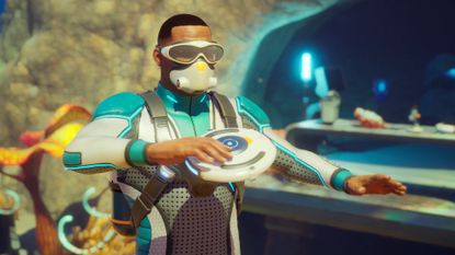 A diver holds a small disc in Subnautica 2