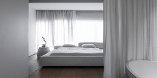 Light interiors with a white bed