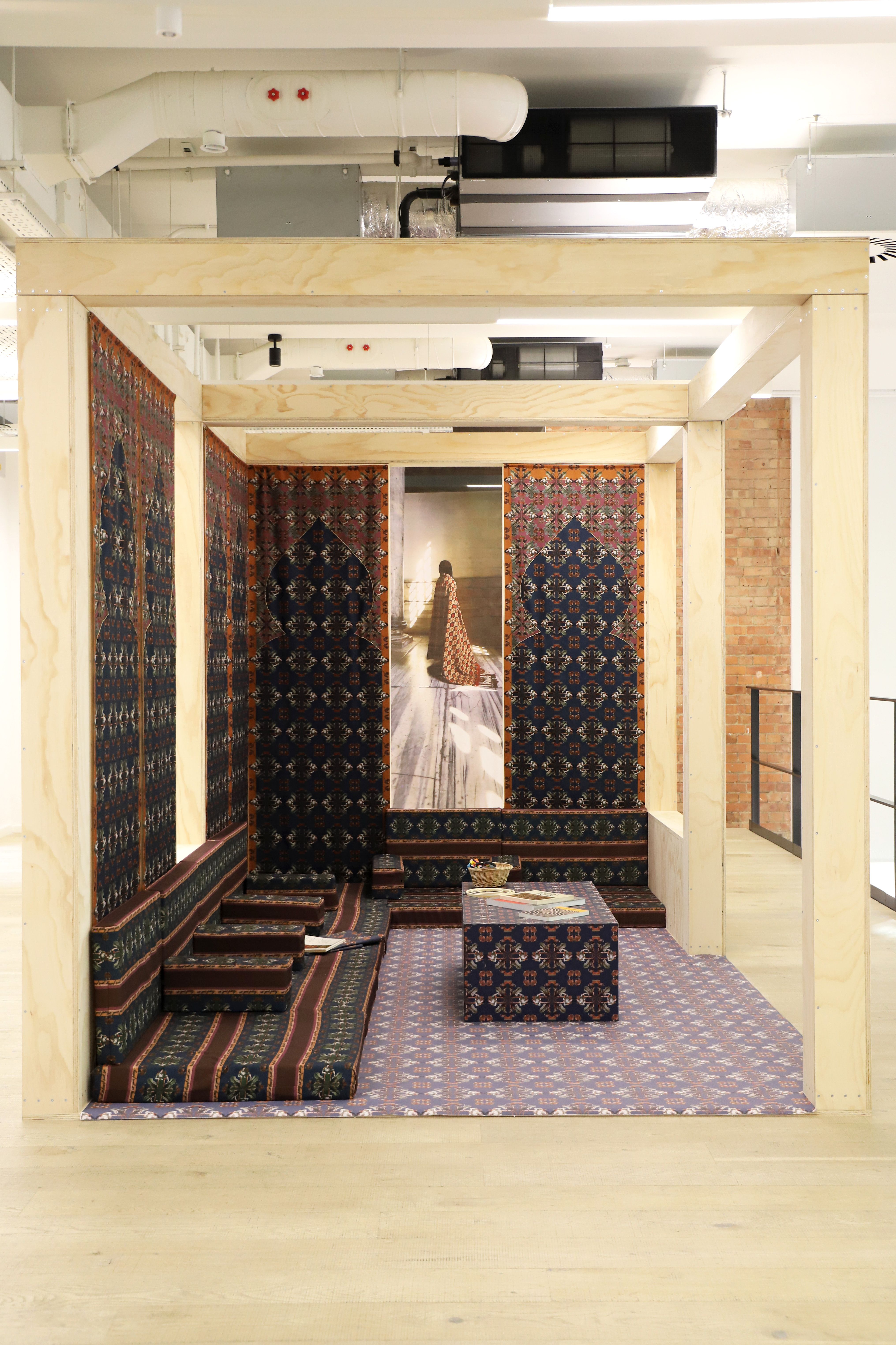 Richly layered interiors and exteriors shots of environments decorated with contrasting patterns, plush textiles, framed original artwork, pastel palettes, and plenty of natural light.