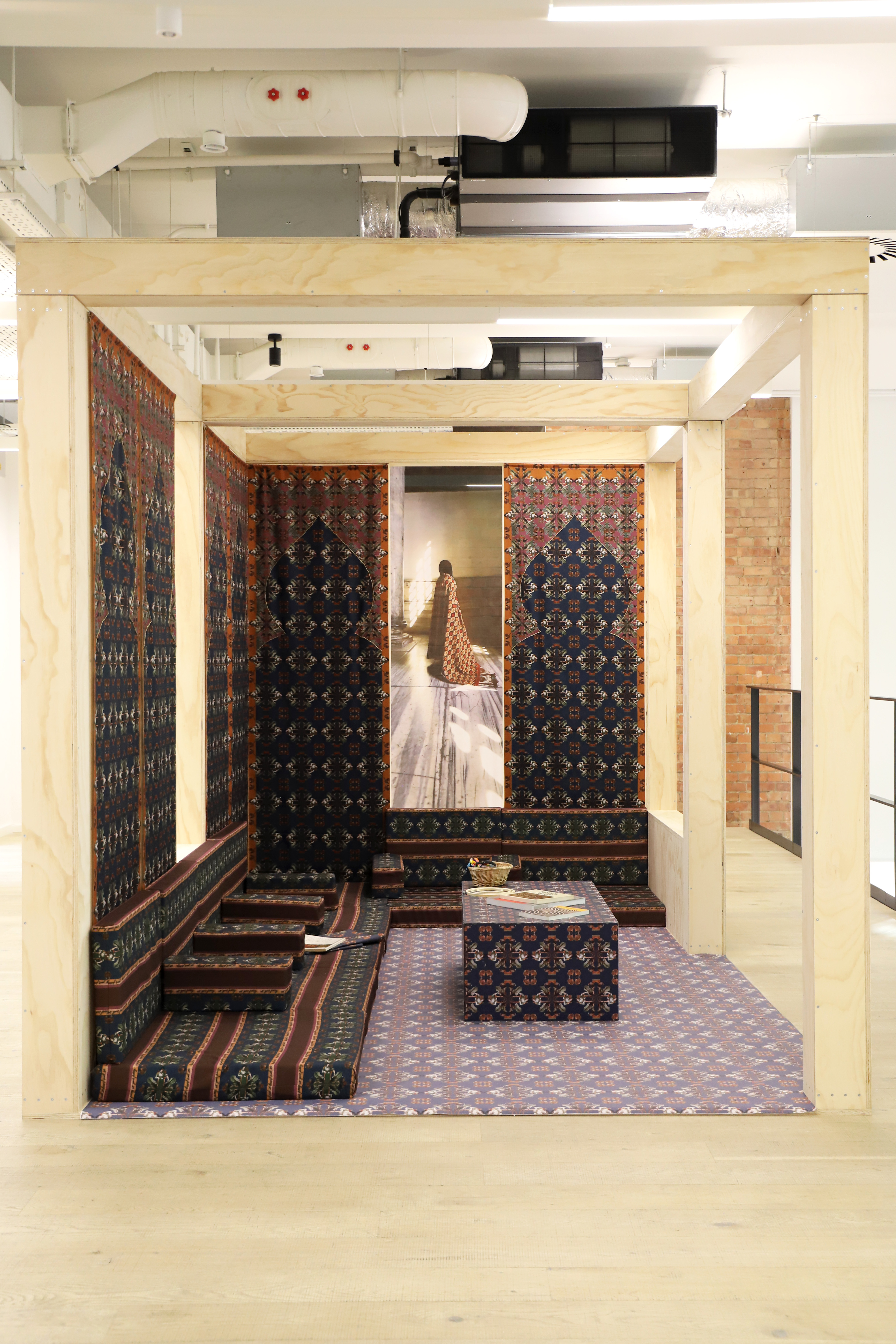 Richly layered interiors and exteriors shots of environments decorated with contrasting patterns, plush textiles, framed original artwork, pastel palettes, and plenty of natural light.