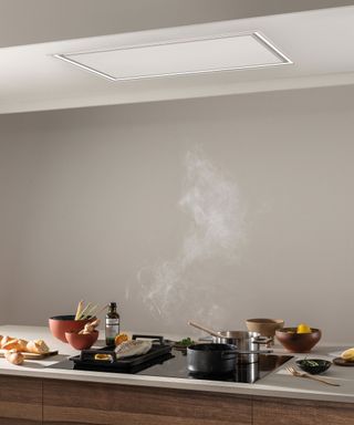 modern extractor hood over induction hob