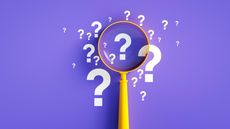 A magnifying glass rests on a purple background among several question marks.