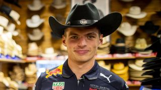 Max Verstappen of Red Bull Racing tries on a cowboy hat ahead of the US Grand Prix in Austin, Texas.