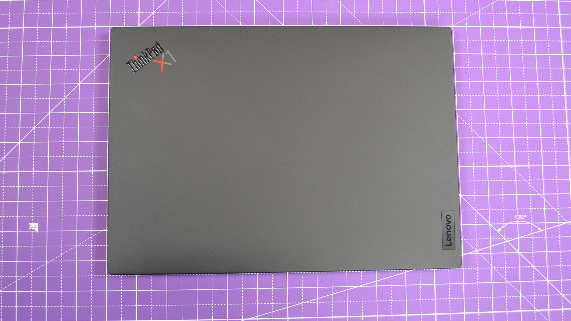 A Lenovo ThinkPad X1 Nano Gen 3 on a desk with a purple desk mat