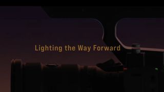A screenshot of a teaser with the words "lighting the way forward" and a camera in silhouette 