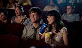 Joseph Gordon-Levitt and Zooey Deschanel enjoying a movie in 500 Days of Summer