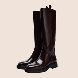 Flat lay image of brown knee high boots