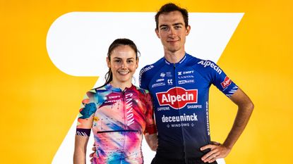 Alex Morrice and Luca Vergallito pose in front of an orange background