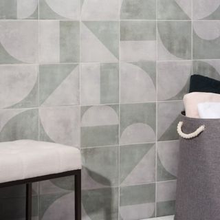 Light green and gray tiles in curved interlocking shapes