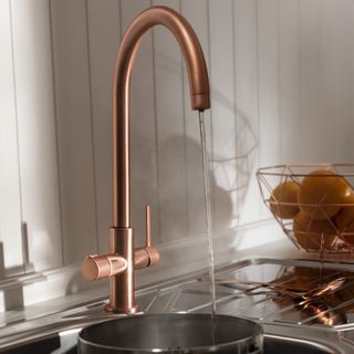 kitchen sink with copper tray and fruit tray
