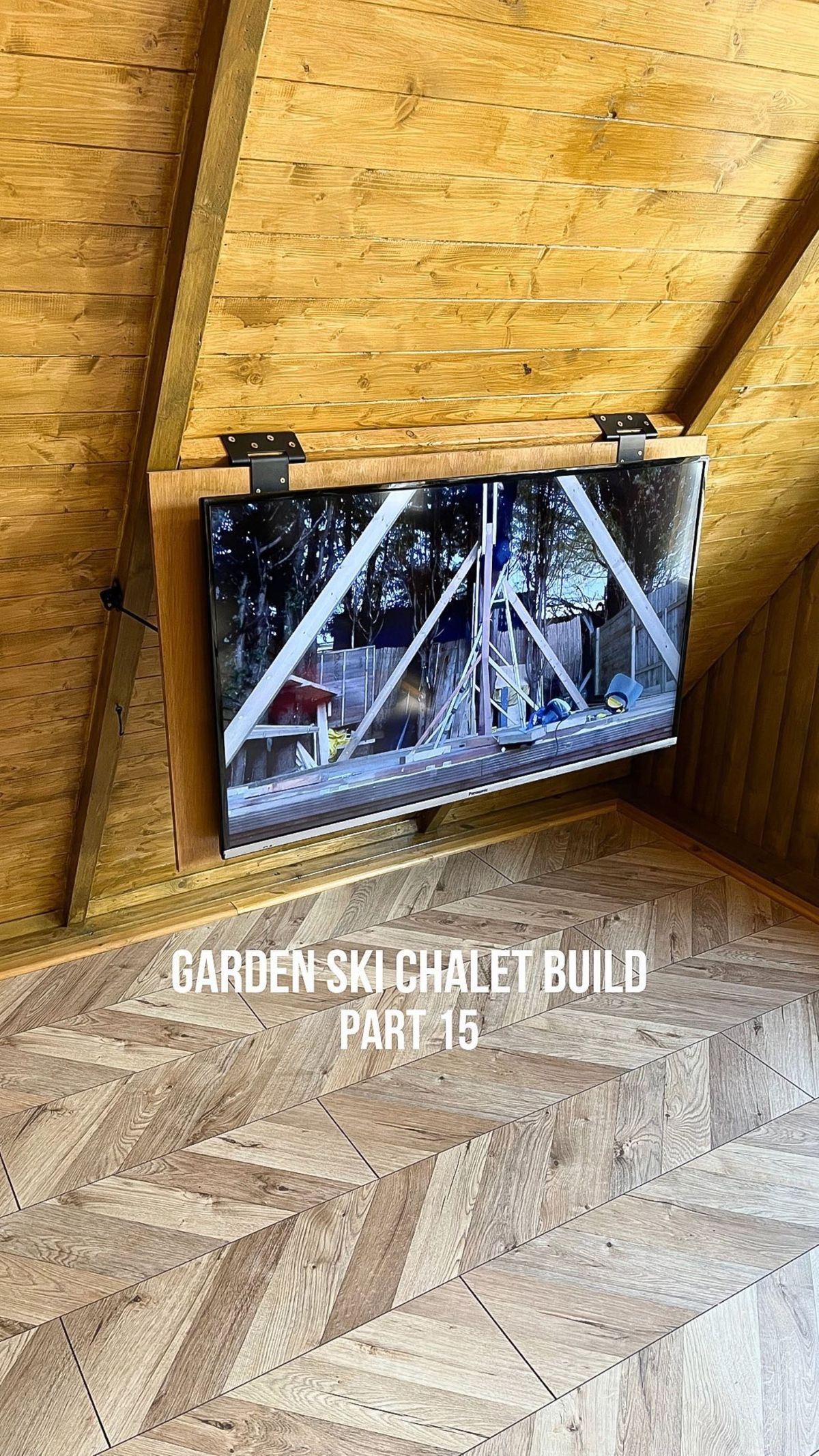 The shed includes a TV installed into the wood panelled wall