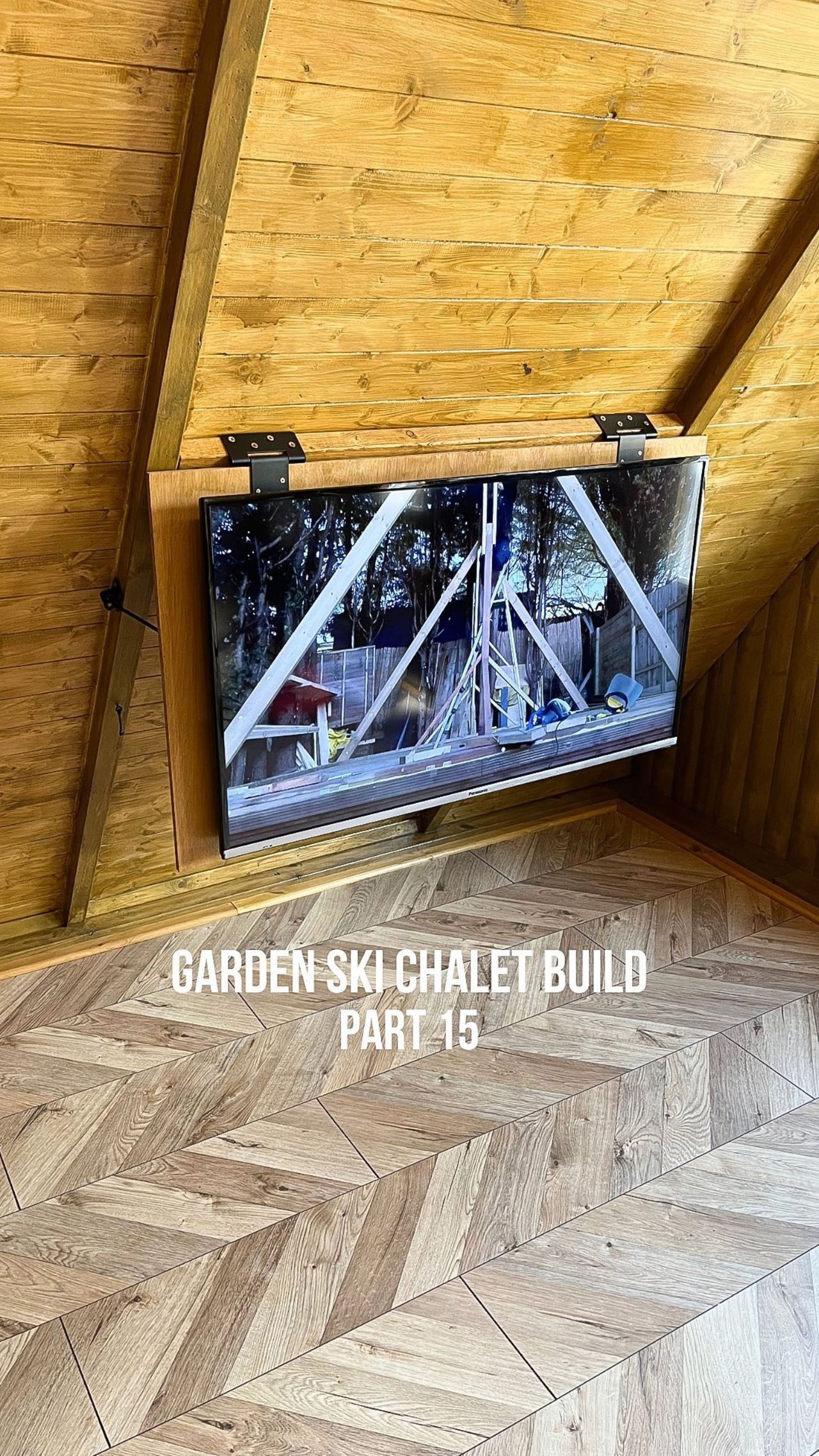 The shed includes a TV installed into the wood panelled wall