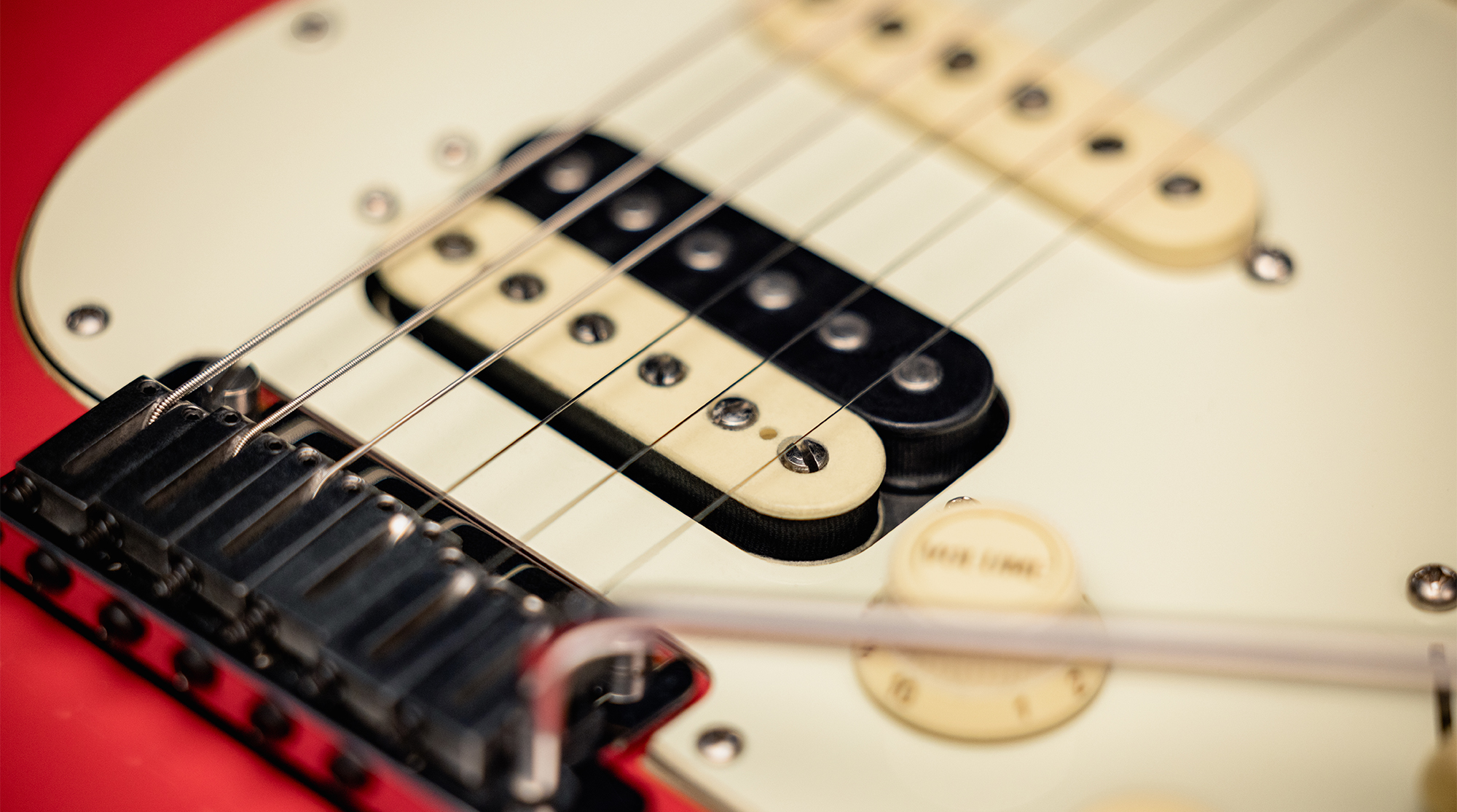 A detail photo of the Fender American Ultra Luxe Vintage &amp;rsquo;60s Stratocaster HSS in Fiesta Red