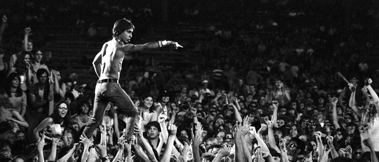 Iggy Pop LiveIggy Pop of the Stooges rides the crowd during a performance at the Cincinnati Pop Festival at Crosley Field, Cincinnati, Ohio, 13th June 1970