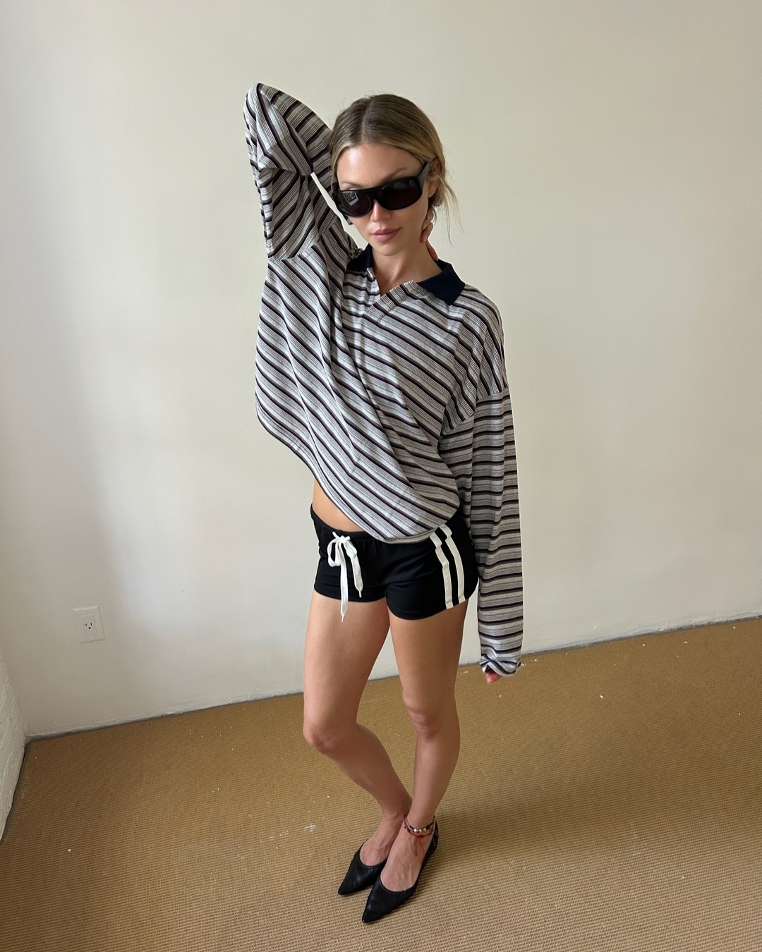 Jessie Andrews in striped top and shorts
