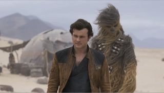Han Solo and Chewbacca on desert planet Savareen in Solo: A Star Wars Story