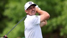 Bryson DeChambeau takes a shot during the third round of The Masters