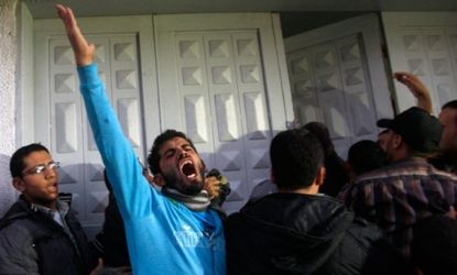 Palestinian men react at a hospital in Gaza city after the body of Ahmed Jabari, head of the Hamas military wing, was brought in on Nov. 14.
