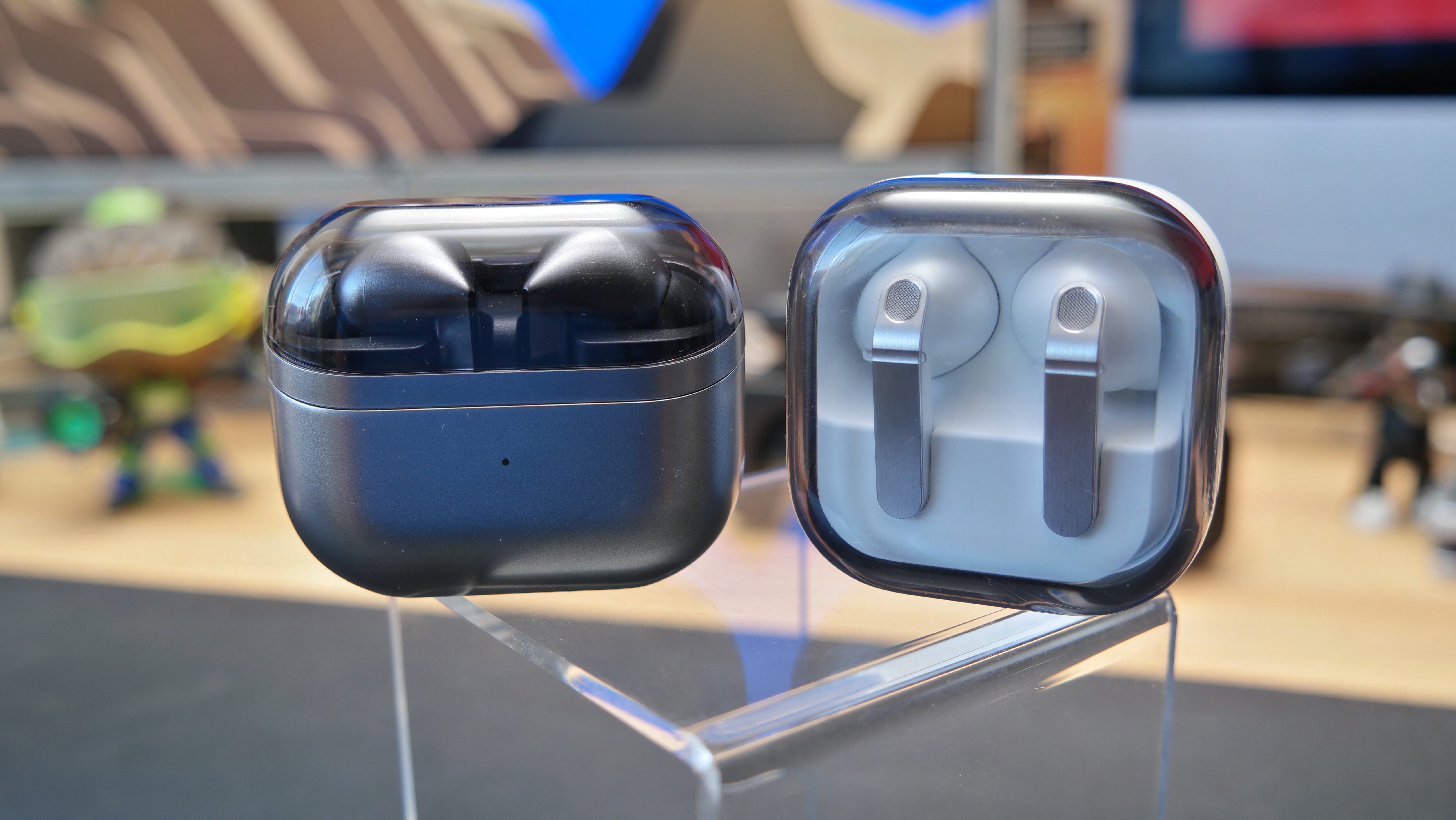 Galaxy Buds 4 Pro on a desk, next to Galaxy Buds3 Pro