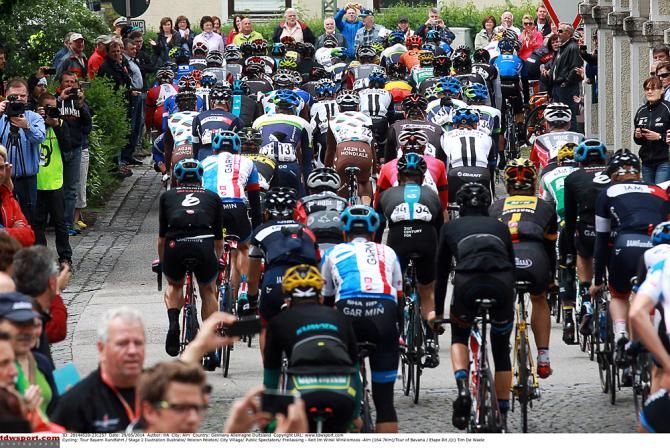 The peloton kicks off stage two in Freilassing