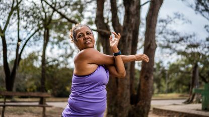 Woman stretching in park