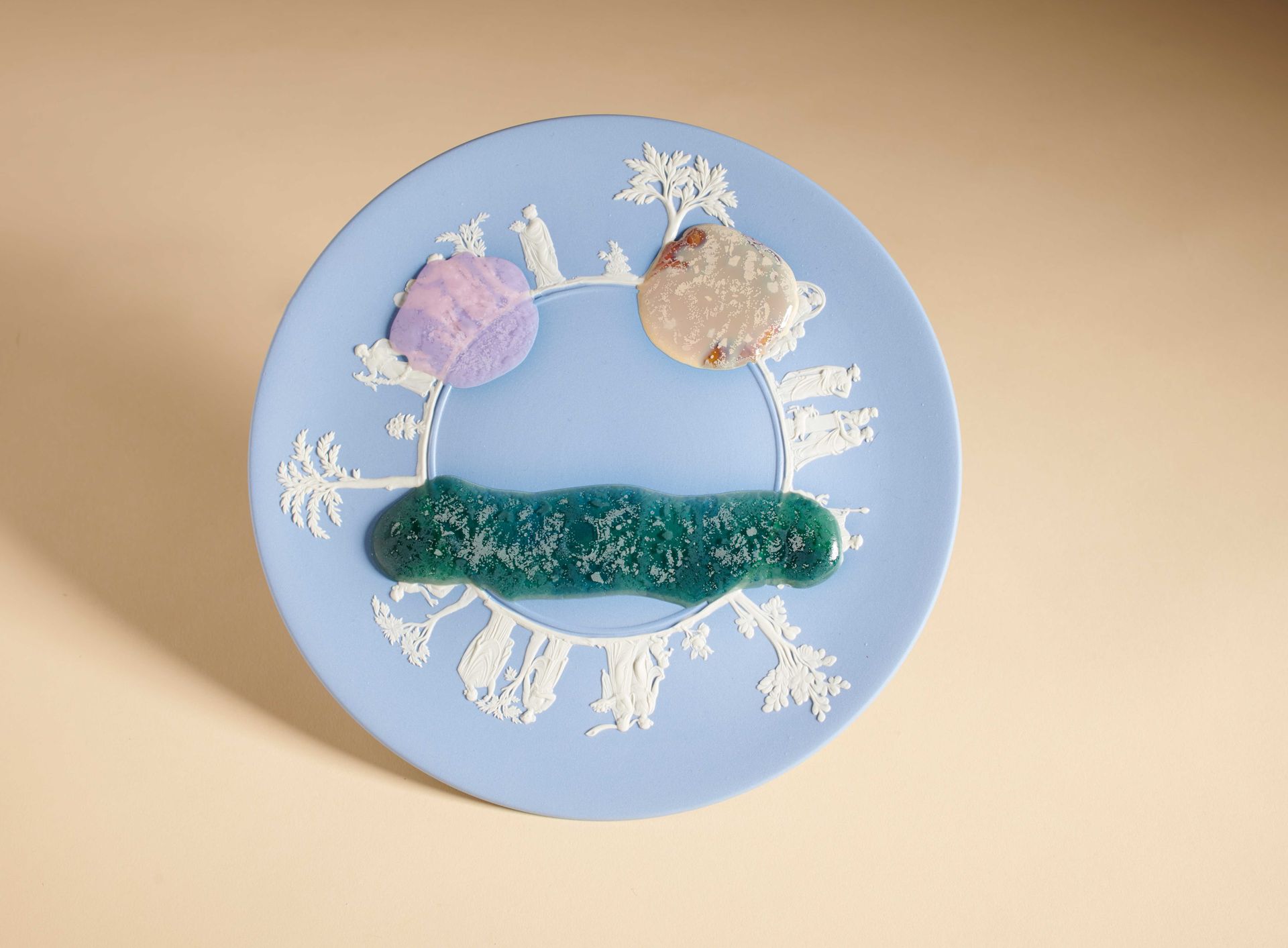 blue plate with blobs in shape of eyes and mouth