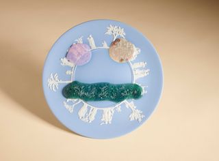 blue plate with blobs in shape of eyes and mouth