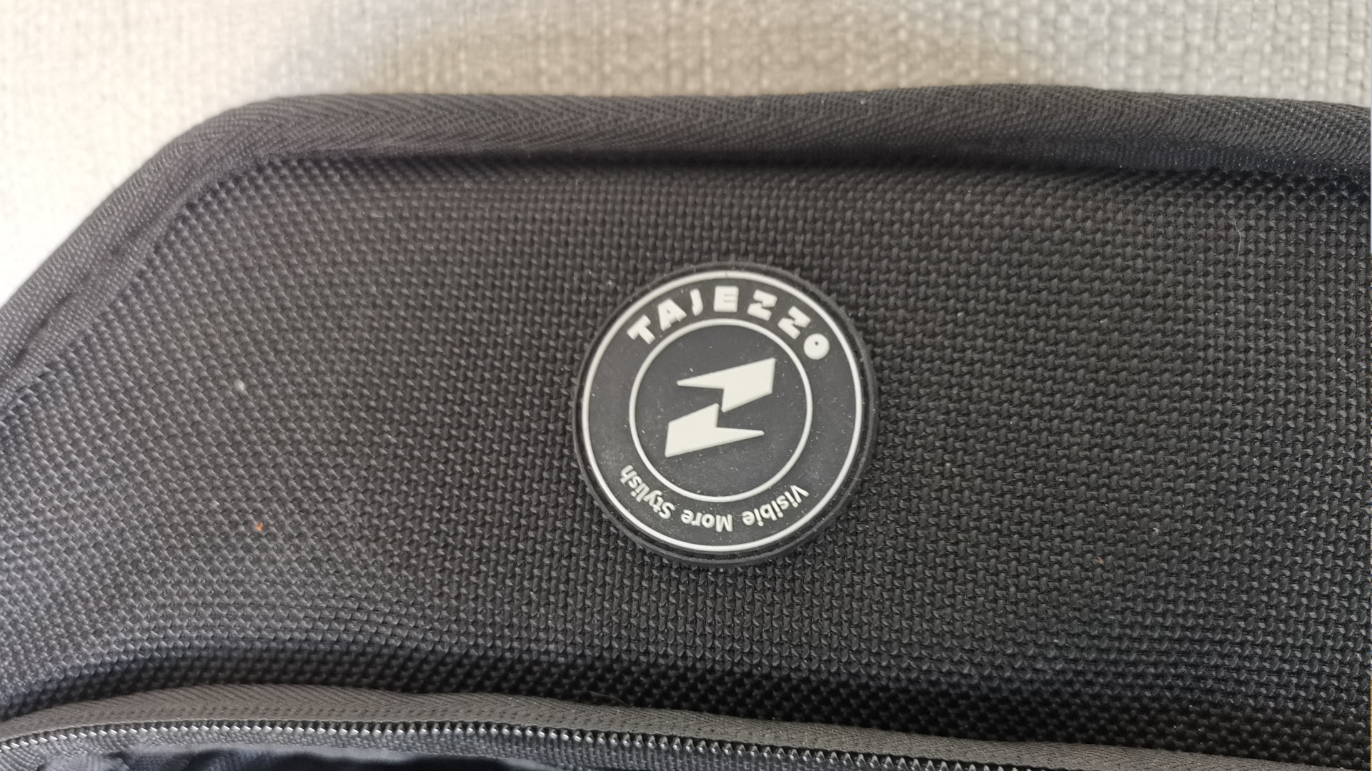 The rubber logo on the Tajezzo PZ5 backpack