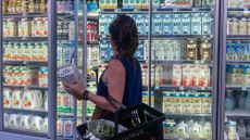 A woman shops for oat milk at a supermarket in Santa Monica, California
