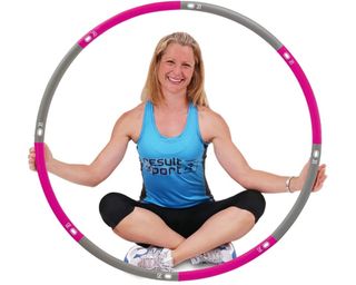 woman holding the ResultSport UK The Original Weighted Hula Hoop
